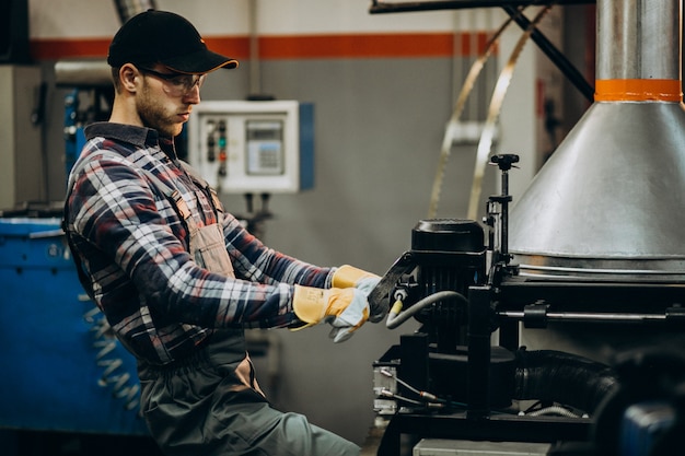 Man working on steel fatory and equipment for steel production