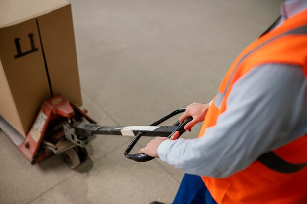 Man working with heavy box