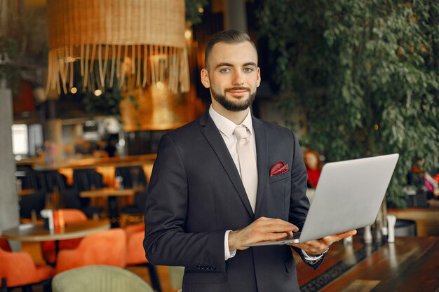 Man working with a laptop at the table