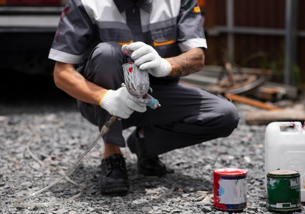 Man working with paint front view