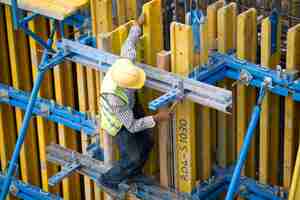 Free photo man working with safety helmet