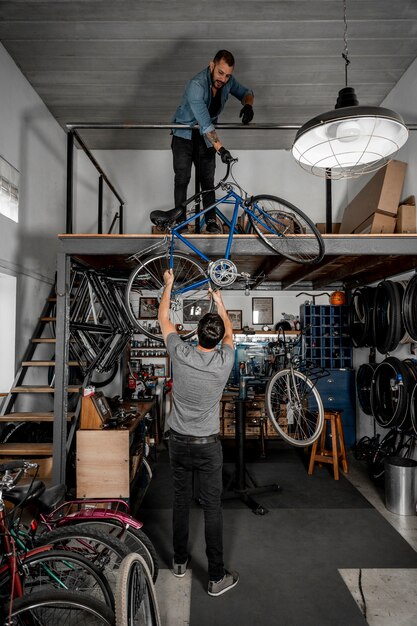 Man in workshop creating bike