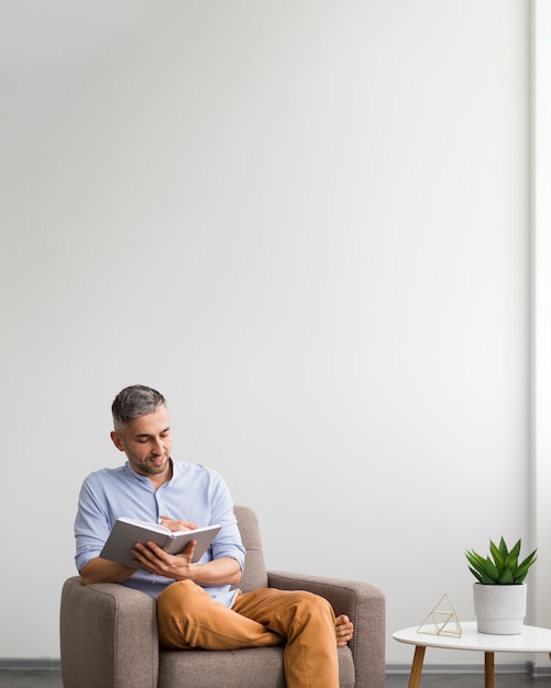 Man writing on his agenda and copy space