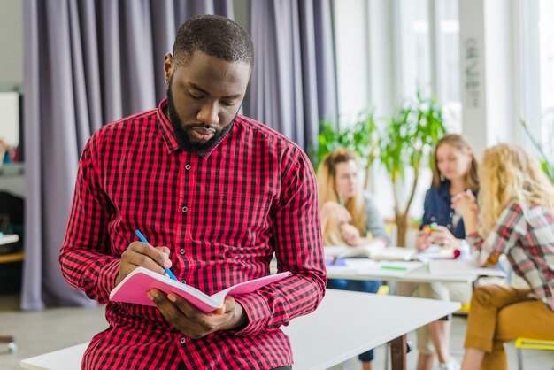 Man writing in notebook