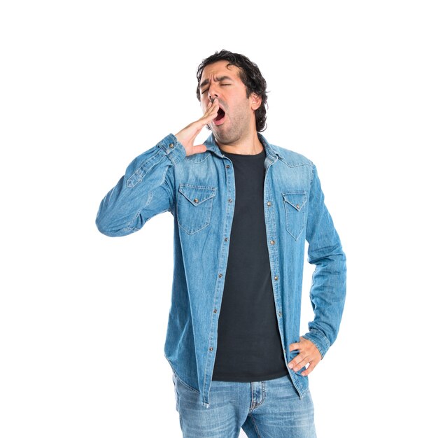 Man yawning over isolated white background