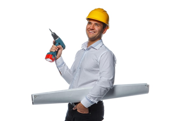 Free photo a man in yellow safe hat with drill and drowing tube isolated on a white background.