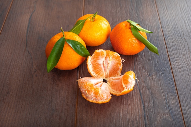 Mandarin on brown wood table fresh fruit