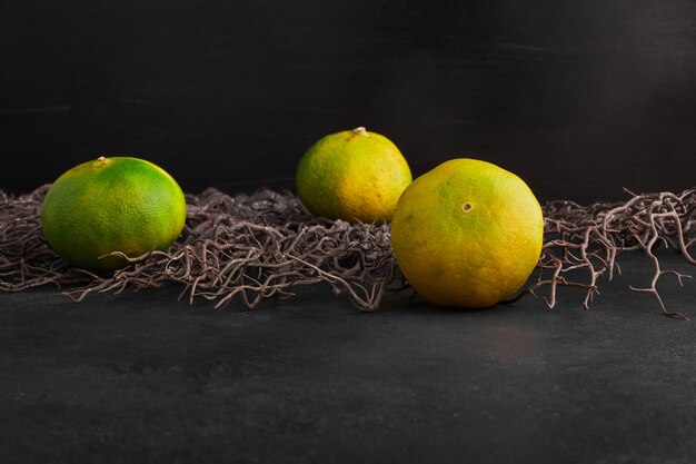 Mandarin oranges on black background . 