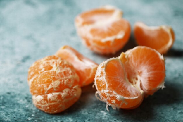 Mandarin oranges on a blue background.