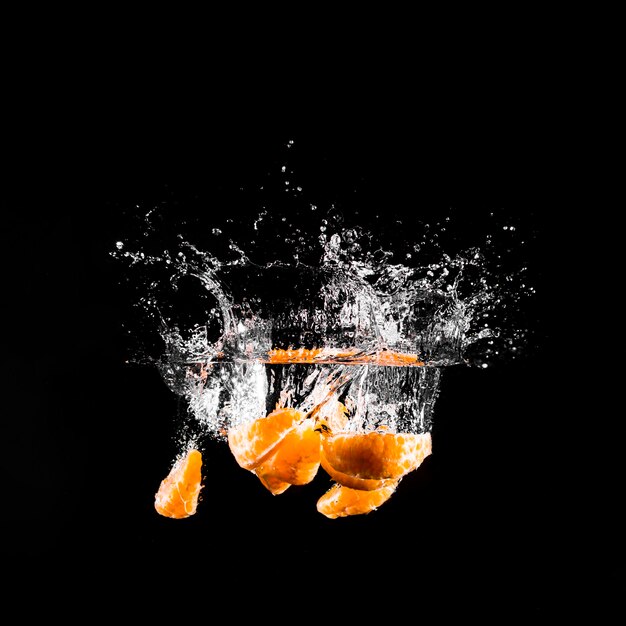 Mandarine plunging into the water