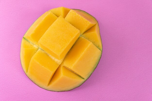 Mango on the pink surface