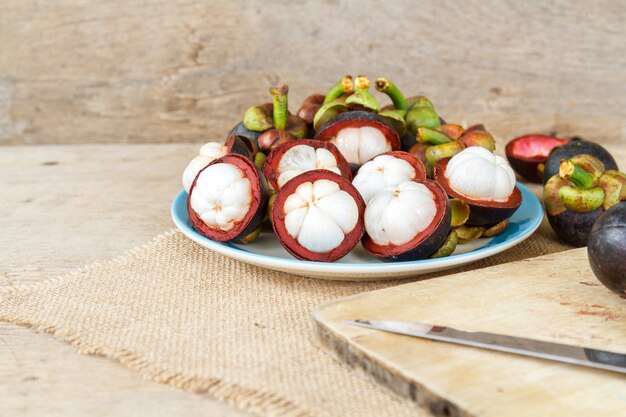 Mangosteen on wood table.