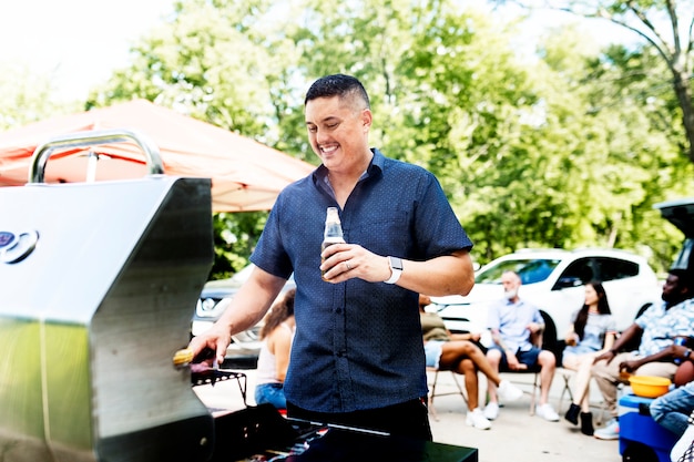 Manning The Grill At A Tailgate Party