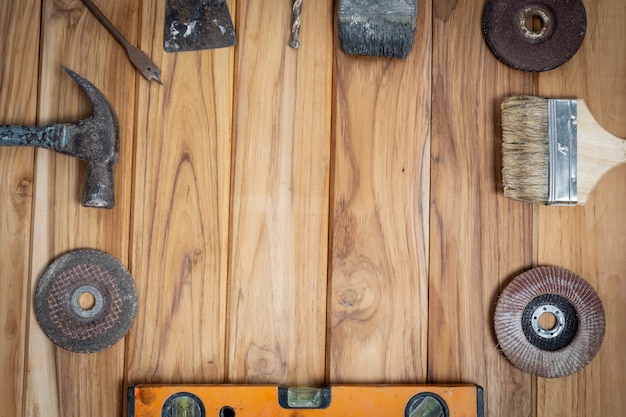 Free photo manual tool set, set on wooden floor.