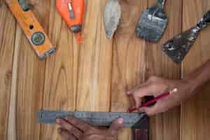 Free photo manual tool set, set on wooden floor.