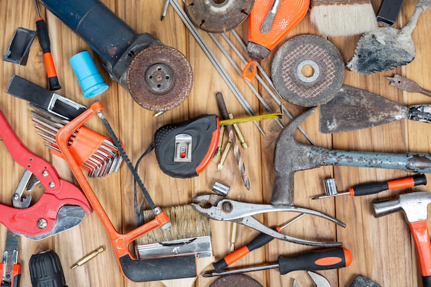 Free photo manual tool set, set on wooden floor.