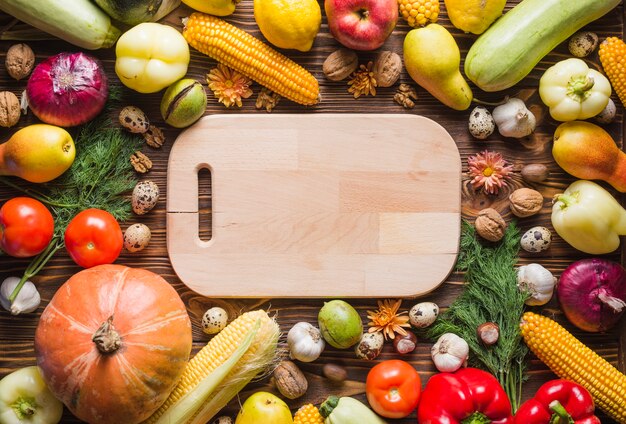 Many autumn vegetables with board in middle