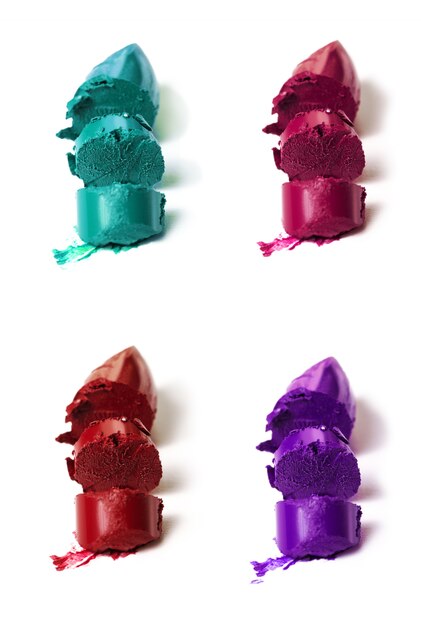 Many beautiful vivid colorful samples of lipstick different colors. Isolated. Collection of lipsticks.