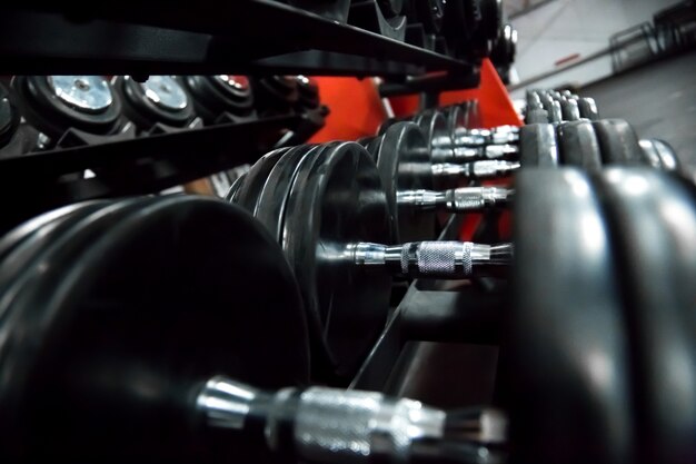 Many black dumbbells