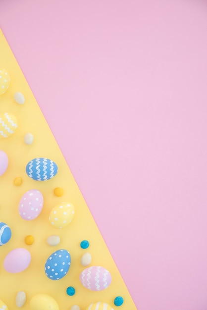 Many colourful Easter eggs on bright table