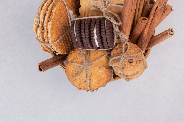 Many of cookies with cinnamon on white.