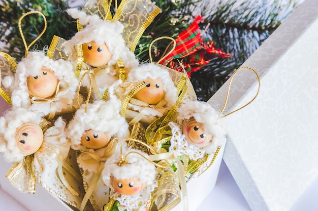 Many dolls ornaments in the box during the christmas