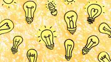 Free photo many hand drawn yellow light bulbs on yellow background