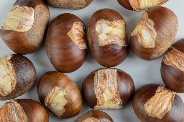 Many of healthy chestnuts on a white bckground.