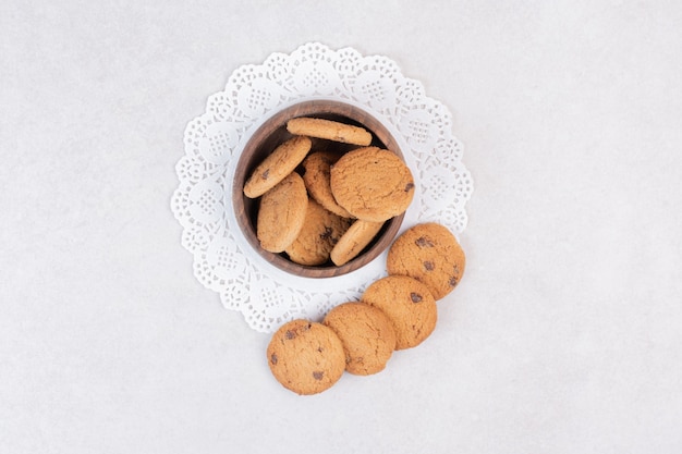 Many of sweet cookies on wooden plate