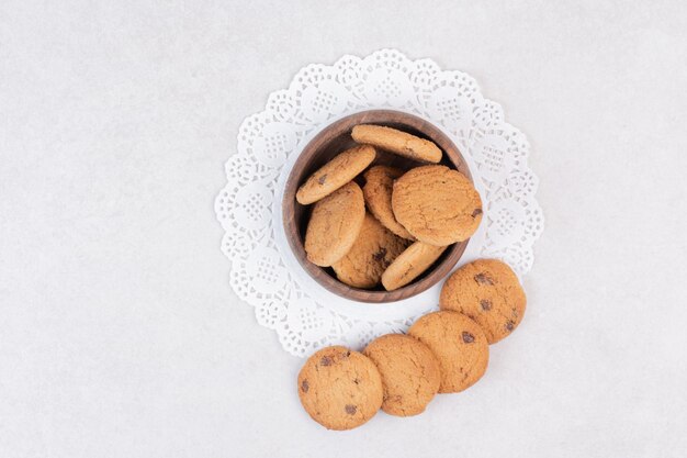 Many of sweet cookies on wooden plate
