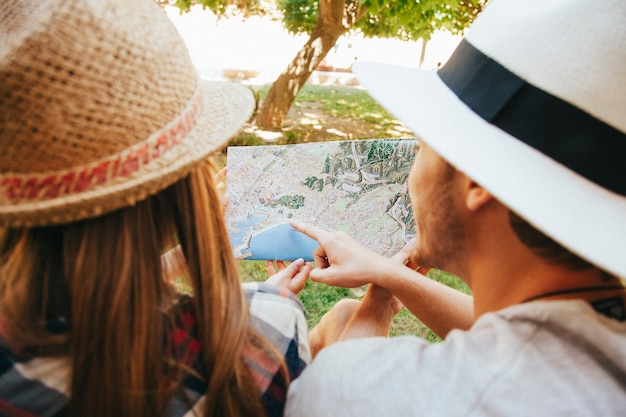 Map and travelers in the park