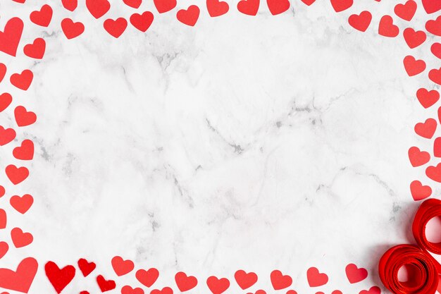 Marble copy space surrounded by hearts