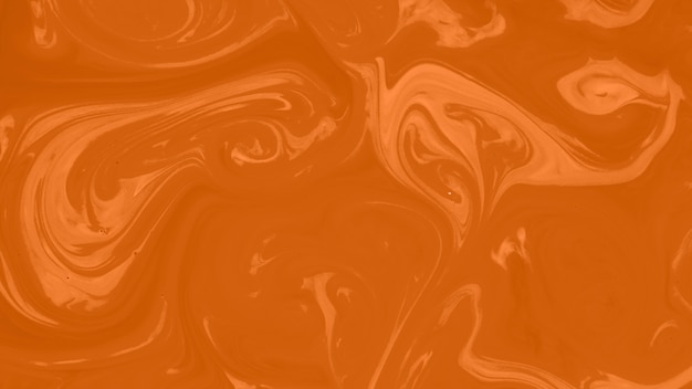 Free photo marble liquefy orange background