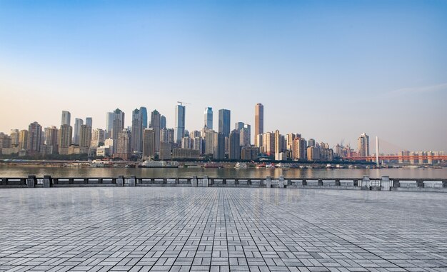 Free Photo marble platform in front of the city skyline