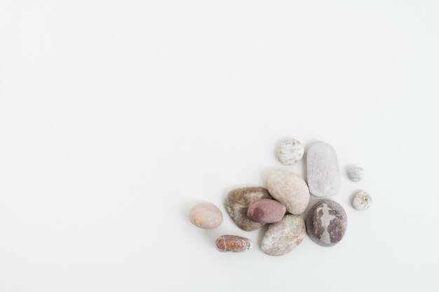 Marble zen stones stacked on white background in mindfulness concept