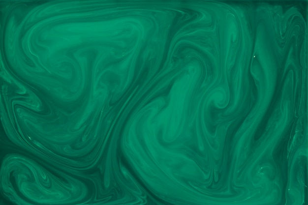 Marbled green fluid abstract background
