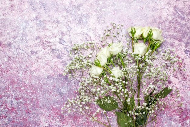 March 8 Women's Day card with white flowers,sweets and a cup of tea .