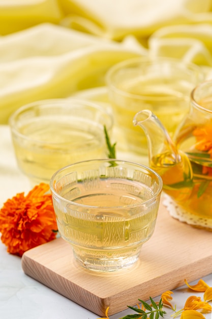 Marigold, lemon, honey herbal tea treatment concept.