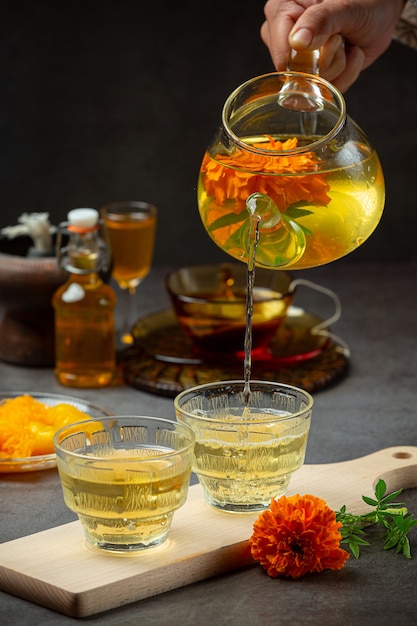 Free photo marigold, lemon, honey herbal tea treatment concept.