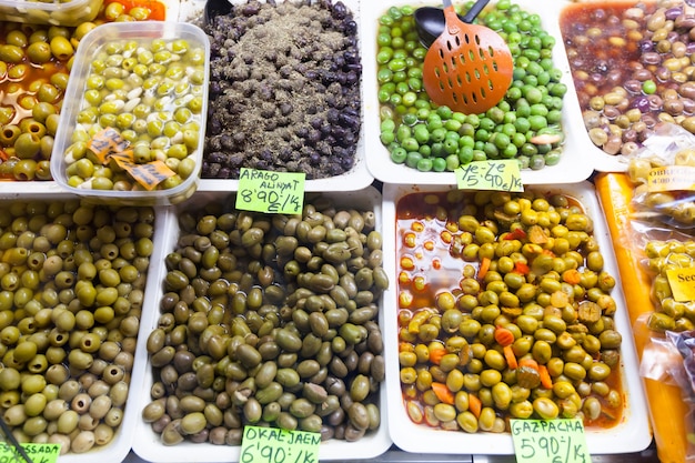 marinated olives in cans at  market