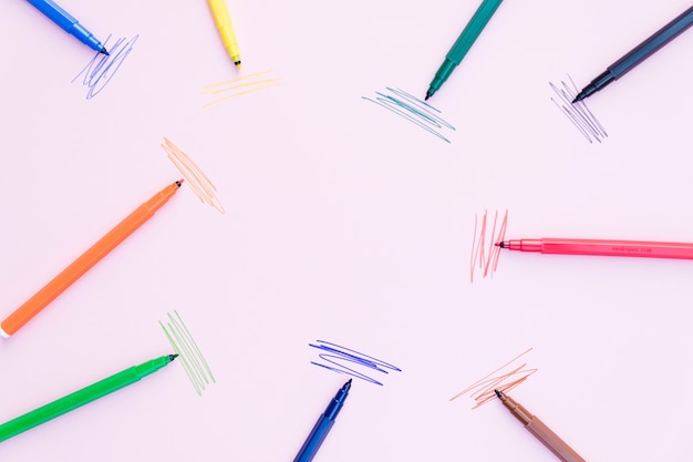 Free photo marker pens lying near strokes