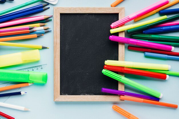 Markers on top of chalkboard slate