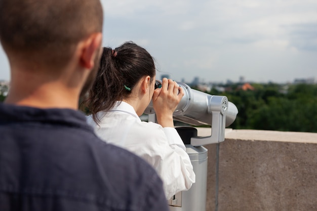 Married couple celebrating relationship anniversary on building tower