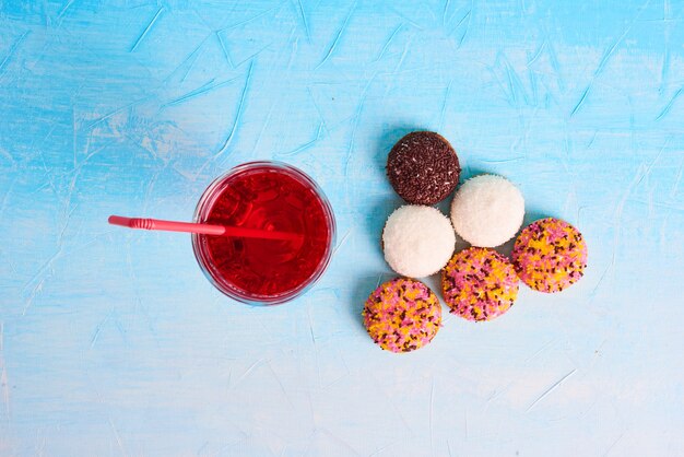 Marshmallow cookies with a glass of juice, top view. 