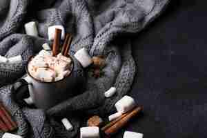 Free photo marshmallow drink with cinnamon on table