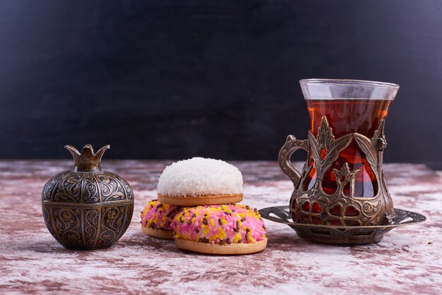 Marshmallow puff cookies with a glass of tea. 