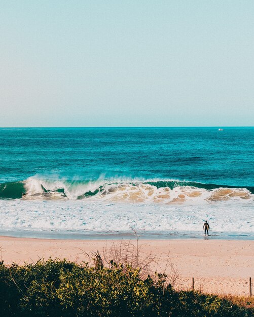 Marvelous scenery of ocean waves splashing to the shore in Rio de Janeiro