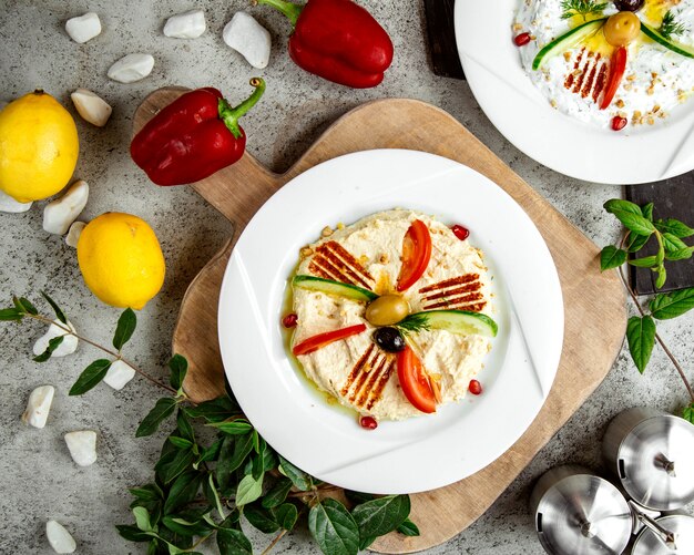 Mash topped with vegetables and pomegranate