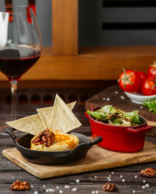 mashed potato with herb flatbreads on cast iron pan, served with salad