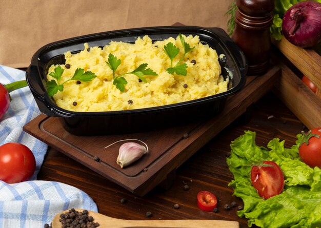 Mashed potatoes with herbs and fresh parsley takeaway   